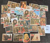 47 Planet of the Apes cards arranged with visible red banners and variety of characters and scenes.