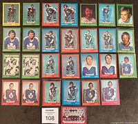 Full lot of 28 Toronto Maple Leafs hockey cards from 1973-74, arranged in 4 rows showing different player cards and team photos.