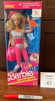 Front view of 1989 Barbie and the All Stars doll in unopened original box, showing doll in pink and white star-patterned outfit with pink bag and visible accessories.