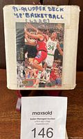 Box with handwritten label '93-94 Upper Deck SE Basketball 1-225' featuring an action basketball card image on front.