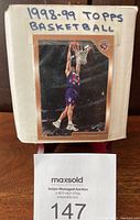 Box containing complete 1998-99 Topps Basketball card set with rec frame and player action photo on front