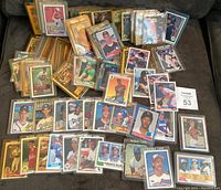 Overview of the collection showing approximately 120 rookie baseball cards from 1978 to 1992 in plastic sleeves.