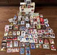 Overview of entire spread of loose cards, inserts and promotional cards