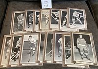 Lot of 15 black and white Beehive Series 2 hockey photos laid out showing players from Detroit Red Wings and Boston Bruins with wooden look frames