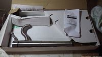 Venus chrome bathroom faucet in original box with faucet and manual visible inside the packaging.
