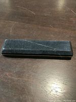 Closed black velvet box containing the bracelet inside.