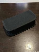 Closed black fabric zipper case for watchmaker tools