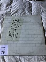 Front of gatefold sleeve for Pink Floyd The Wall, shows title and brick wall artwork.