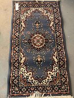 Photo of one of the tapestry runners showing the full design and fringe ends.