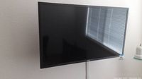 Front view of the Samsung 33 inch LED TV mounted on wall.
