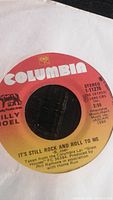 Close-up photo of a Billy Joel vinyl record label for the single "It's Still Rock and Roll To Me" from Columbia Records, stereo, catalog number 1-11276.
