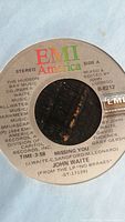 Close up of side A label of John Waite 45 RPM vinyl record showing song "Missing You" details.