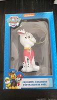 Photo of Marshall Dalmatian Christmas ornament in packaging showing front and side of the box with Paw Patrol branding.