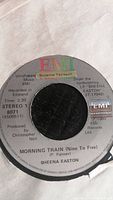 Close-up of Sheena Easton 45 RPM vinyl record label of 'Morning Train (Nine To Five)' single by EMI Records, showing copyright year 1980 and production credits.