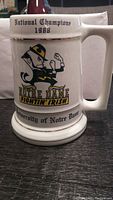 Front view of the ceramic stein showing the mascot, National Champions 1988 text, and University of Notre Dame base text.