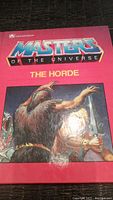 Front cover of the Masters of the Universe book titled 'The Horde' showing colorful and detailed character artwork and the logo.