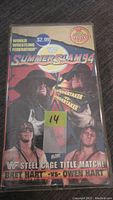 Front cover of WWF SummerSlam 94 official VHS rental tape with images of Undertaker and the Hart brothers, including pricing sticker.