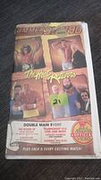 Photo of the front cover of a vintage WWF Summerslam 1990 VHS rental tape titled 'The Heat Returns', showing wrestlers Hulk Hogan, Ultimate Warrior, Earthquake, and Rick Rude.