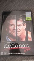 Front cover of WWF McMahon 2-Disc Collector's Edition DVD showing split portrait of Vince McMahon.