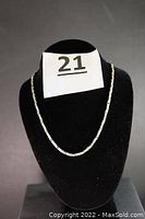 Front display of the 24-inch sterling silver neck chain on black velour bust stand showing chain pattern and length.