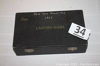Closed black Leica box labeled 'New York World's Fair 1939' with metal clasps