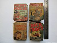 Four Big-Little Books in rough condition: Mickey Mouse: The Pirate Submarine, Popeye in The Deep Sea Mystery, Foreign Legion, Dick Tracy. Five missing spines noted.