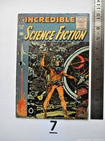 Front cover with astronaut illustration and ruler at right