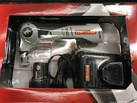 Close-up of Craftsman Hammerhead Auto Hammer in original box showing tool, battery, and charger.