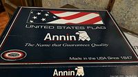 Box with American flag graphic, Annin branding, and text indicating guaranteed quality and Made in USA since 1847.
