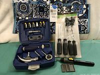 Tools arranged with Kobalt tool kit open showing hammer and bits, Pittsburgh screwdriver set in packaging, and General precision screwdriver with bits outside case.
