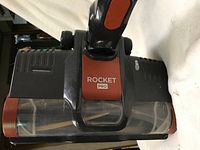 Close-up of the brush head area of the Shark Rocket Pro stick vacuum with visible branding.
