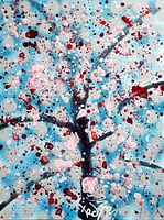 Close-up view of front showing abstract cherry blossom tree motif in pink, red, and white splashes on blue background with artist signature at lower center