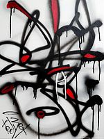 Close up photo showing the texture and details of the black and red abstract lines, with drips of paint, and artist signature in bottom left corner.