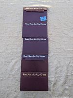 Five maroon presentation folders labeled 1989 through 1993 United States Mint Proof Sets laid out vertically.