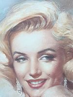Close-up detail of Marilyn Monroe's face and hair from signed print.