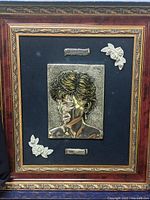 Full view of framed cameo artwork featuring Princess Diana with decorative flowers and plaques.