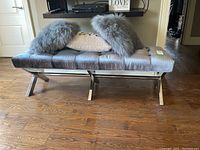 Front view of bench with pillows and nearby shelving