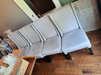 Four chairs side by side showing overall set