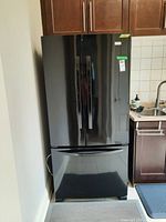 Front view of closed refrigerator showing exterior condition and style