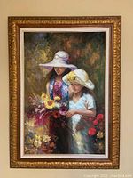 Full view of the framed oil painting showing two girls with hats and a bouquet of flowers.