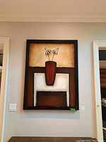 Full view of the wood framed print showing the entire artwork hung on a wall between door frames.