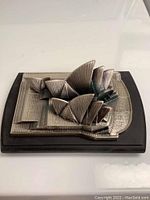 Top angle photo showing the pewter Sydney Opera House miniature with detailed sail-shaped roofs mounted on a wooden base.