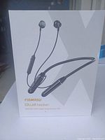 Front of the Figmasu collar headset box showing image and product name.