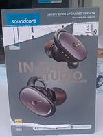 Front box view of Soundcore Liberty 2 Pro earbuds featuring earbuds image and branding, showing box wear and tear.