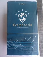 Front of packaging box showing Shaalek branding and product name 'Heated Socks for winter outdoors'