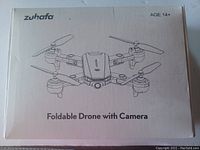 Box showing the Zuhafa brand and foldable drone with camera illustration. Suitable for age 14+.