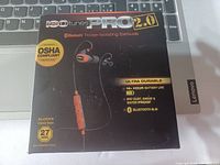 Front of the ISOtunes PRO 2.0 box showing earbuds picture, noise isolating Bluetooth earbuds, OSHA compliant, 27 NRR noise reduction rating, with features such as ultra durable build, 16+ hour battery, IP67 dust/sweat/water proof, and Bluetooth 5.0