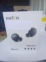 Front of EarFun Free 2 earbuds box showing earbuds image, brand name, and Bluetooth logo.