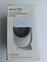 Front view of the boxed Laxihub MiniCam showing the camera image and branding.