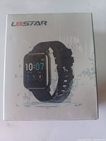 Front photo of sealed product box featuring the fitness tracker image and brand L8star.